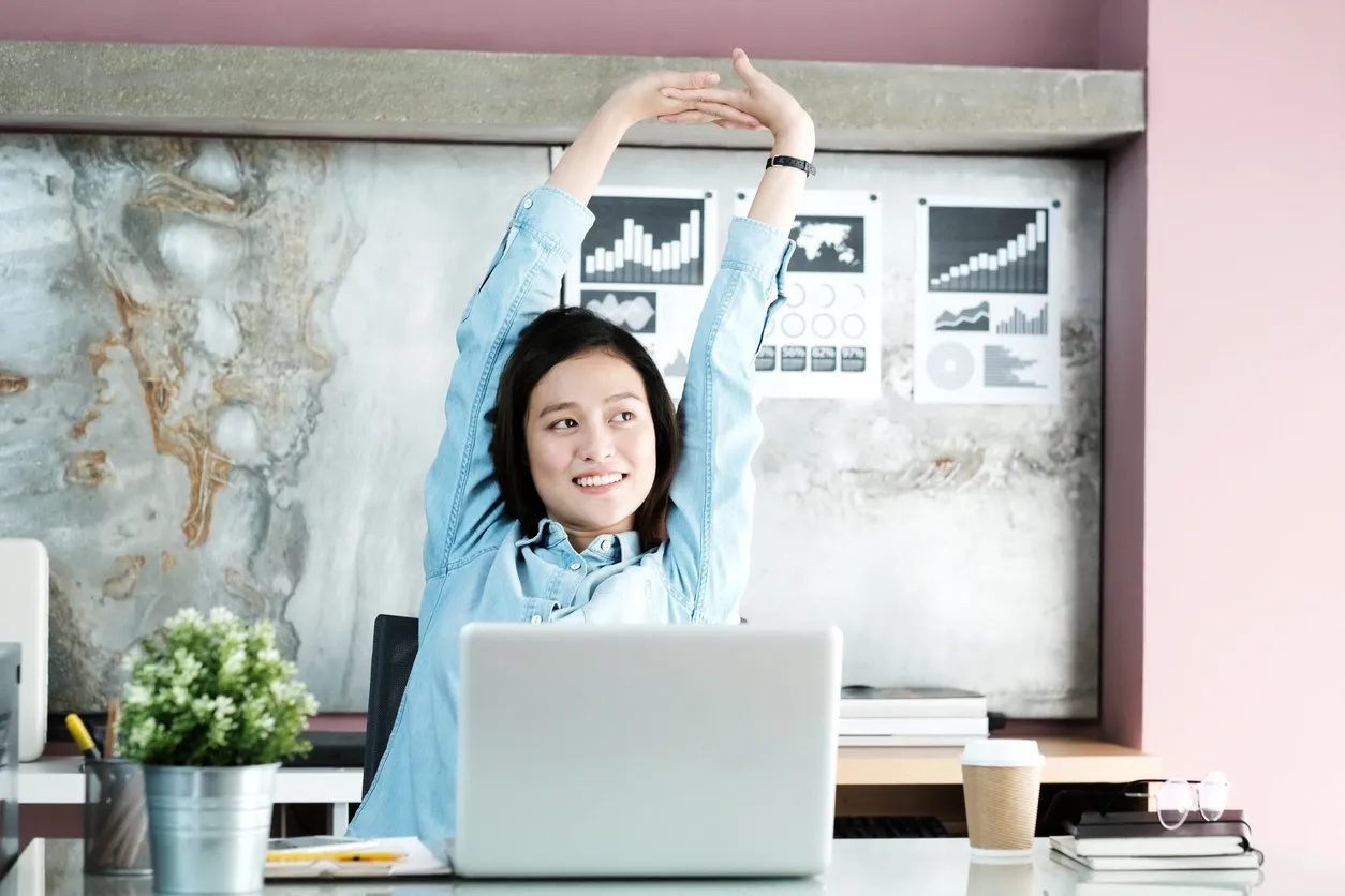 Woman feeling energised while working after one on one executive coaching session