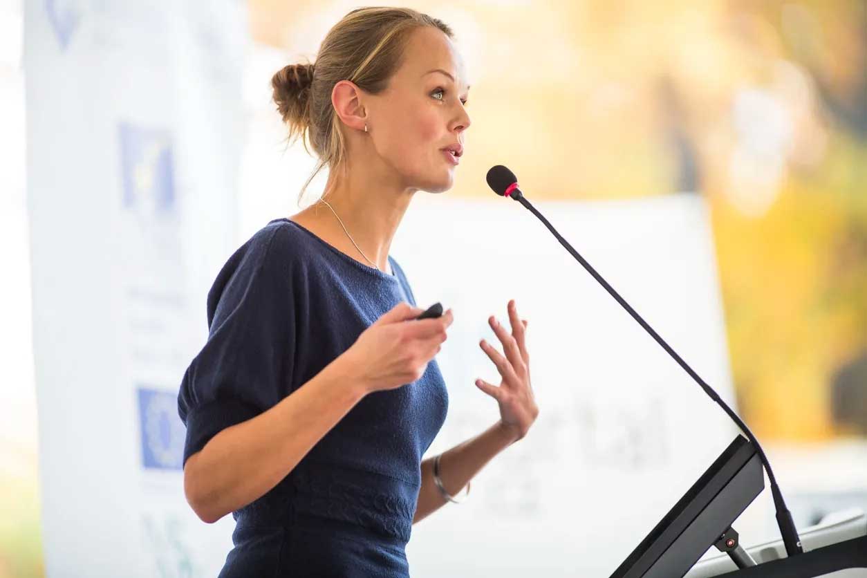 Woman presenting confidently after one on one executive coaching