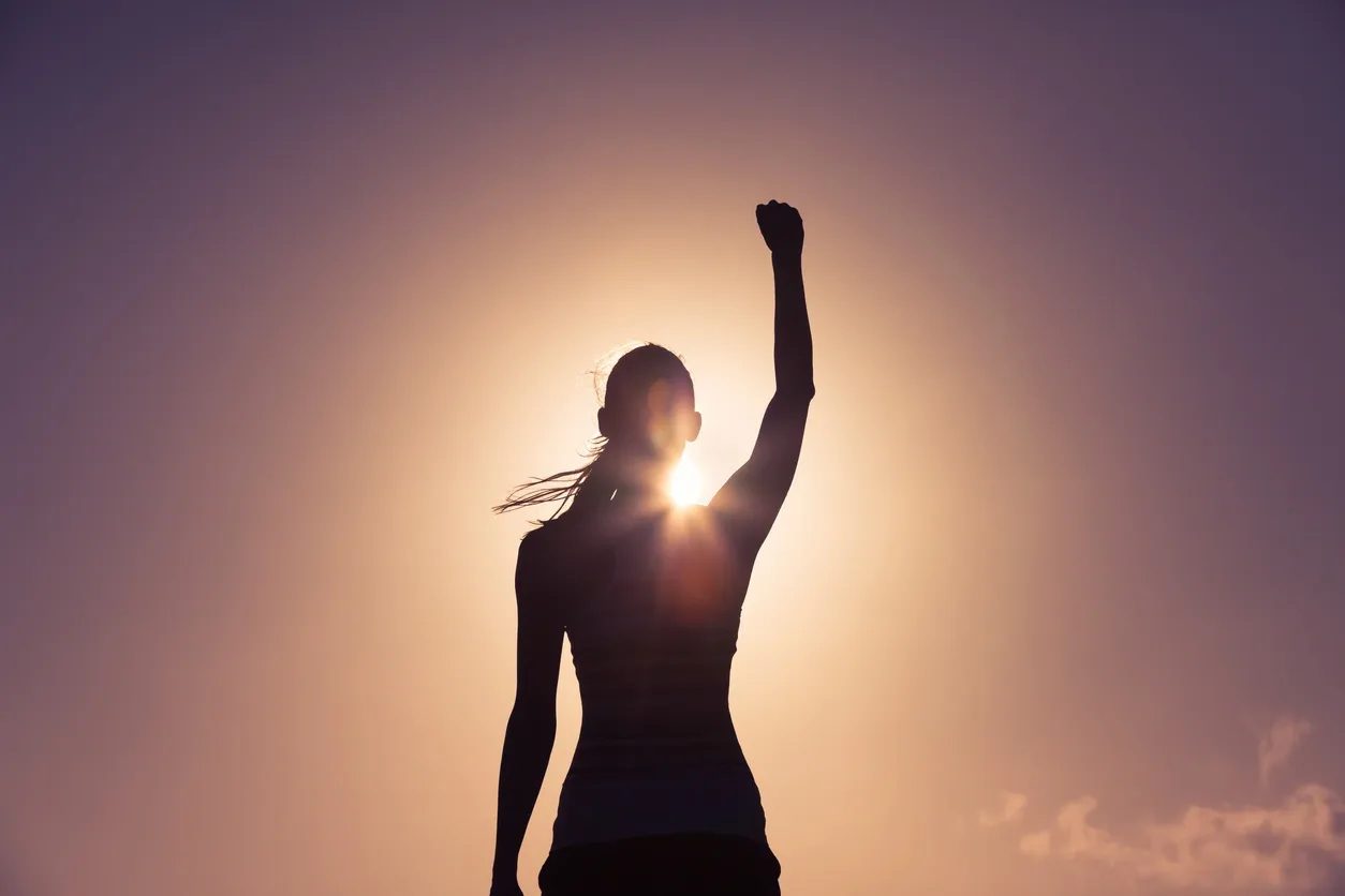 Woman celebrating personal growth after one on one executive coaching